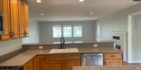 a kitchen with a sink and a stove