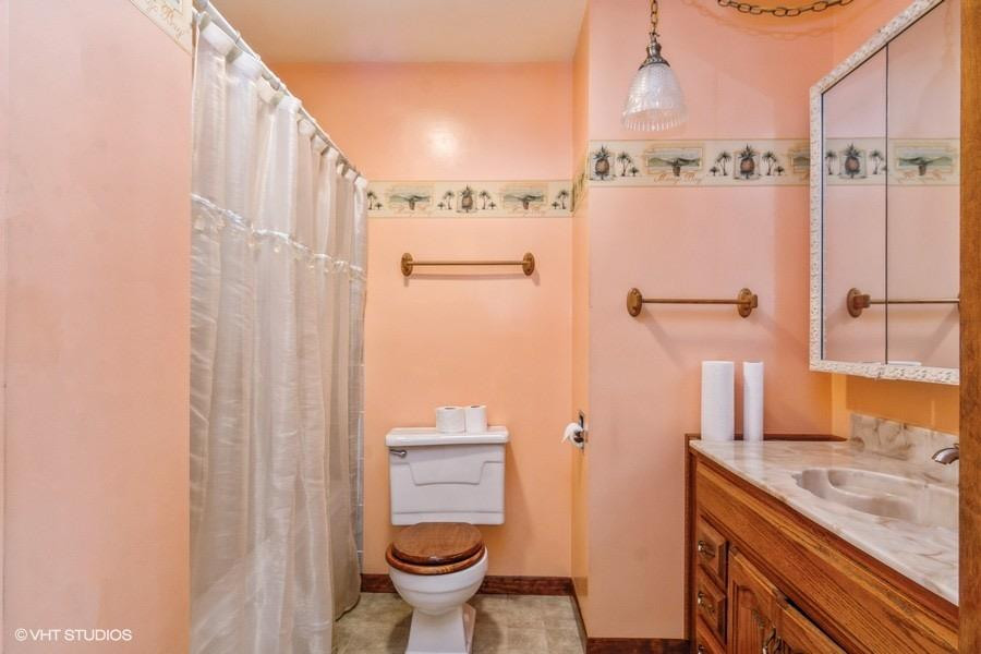 1349 North Dwiggins Street Griffith, IN 46319 - Photo 5 of 15 a bathroom with a granite countertop sink toilet and shower