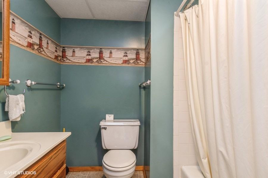 1349 North Dwiggins Street Griffith, IN 46319 - Photo 7 of 15 a white toilet sitting next to a bathroom sink