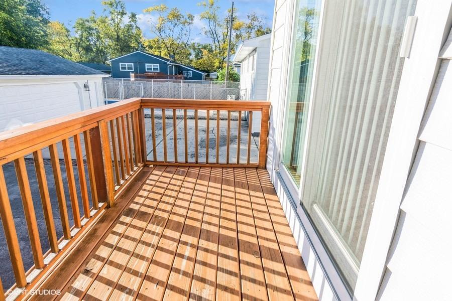 1349 North Dwiggins Street Griffith, IN 46319 - Photo 9 of 15 a view of balcony with wooden floor