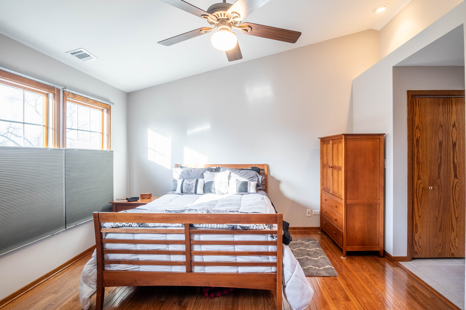 2306 Jay Lane Rolling Meadows, IL 60008 - Photo 14 of 30 a bedroom with a bed and wooden floor