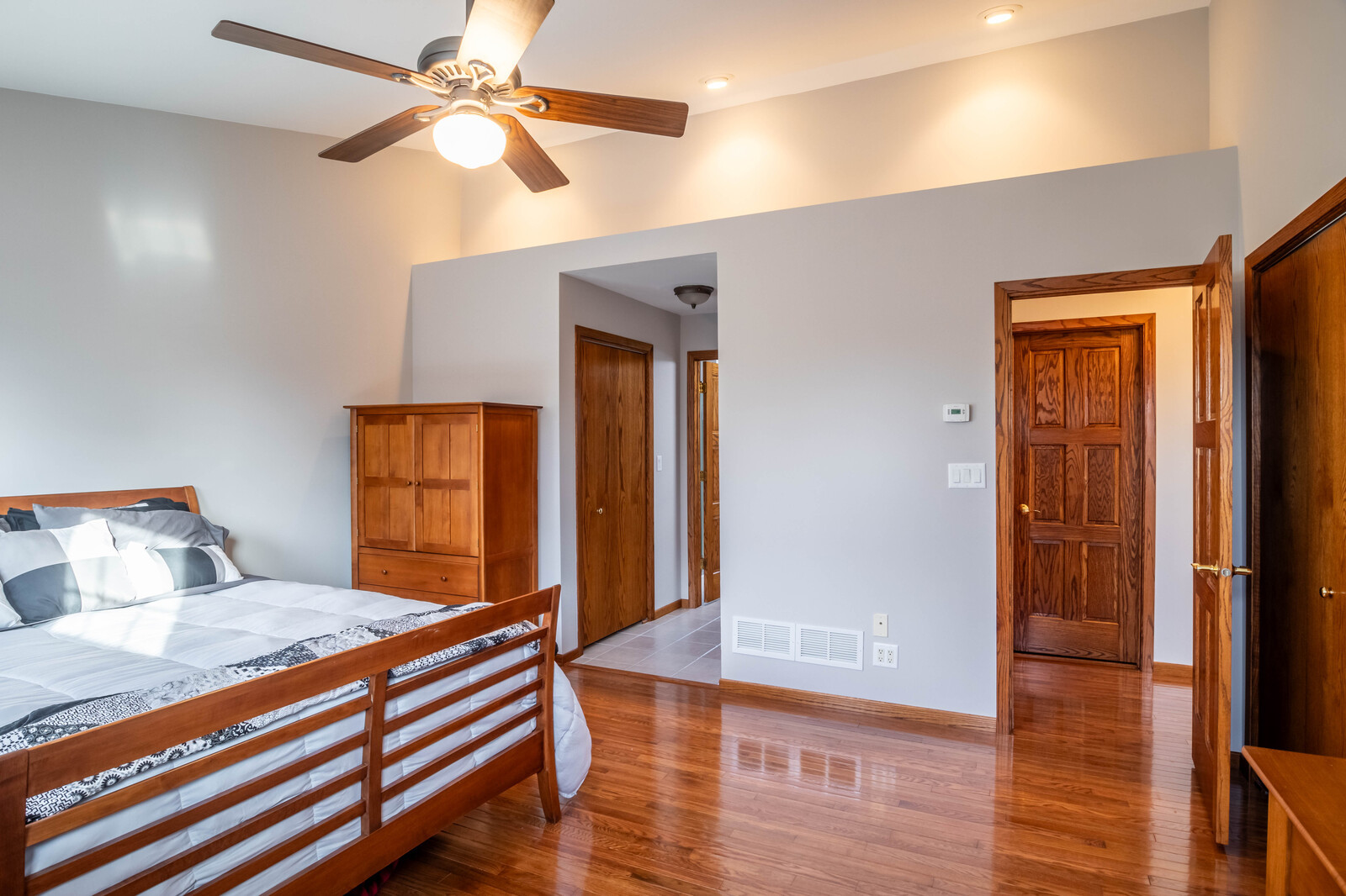 2306 Jay Lane Rolling Meadows, IL 60008 - Photo 16 of 30 a bedroom with a bed and a chandelier