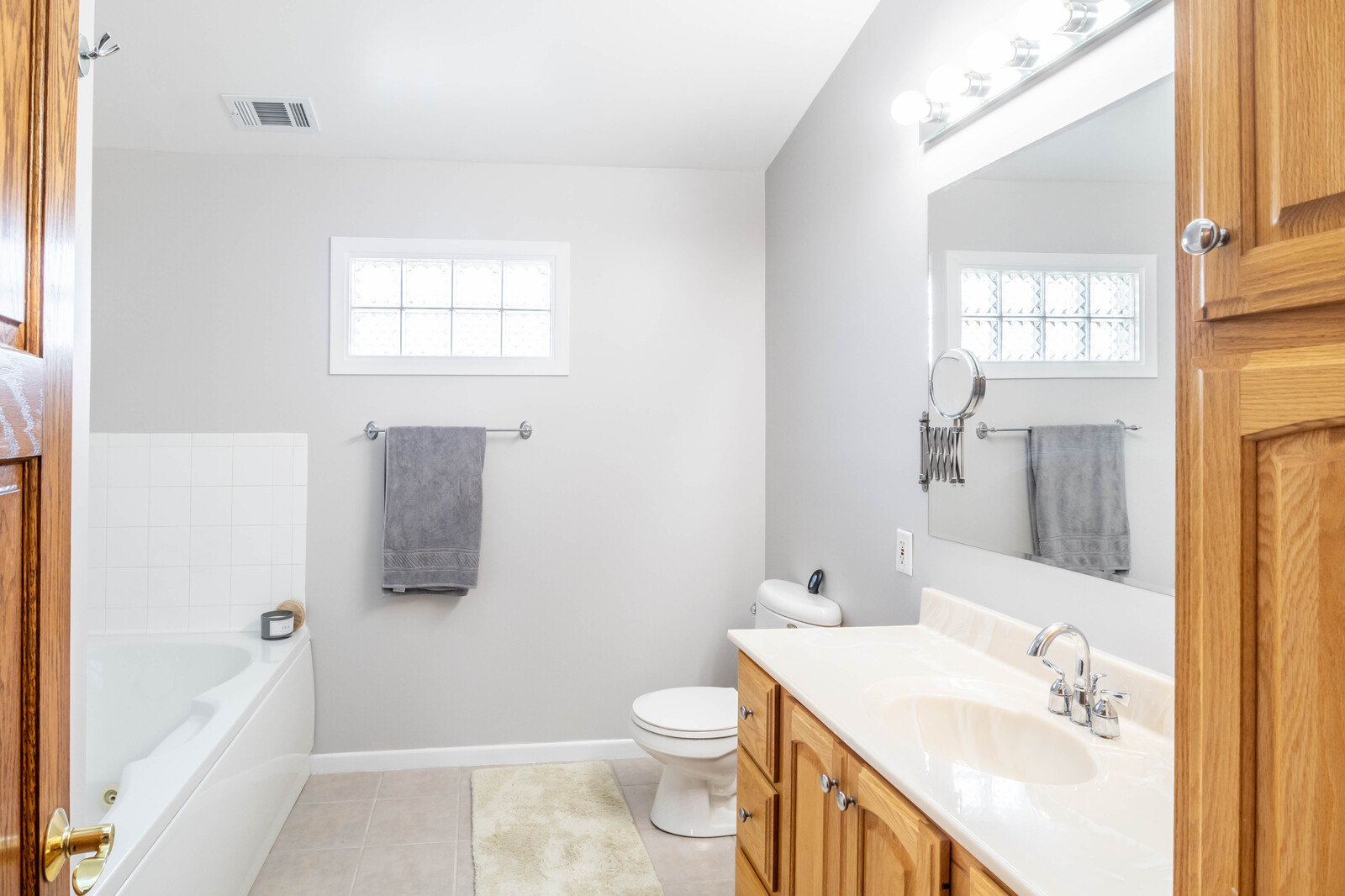 2306 Jay Lane Rolling Meadows, IL 60008 - Photo 18 of 30 a bathroom with a sink a toilet and shower