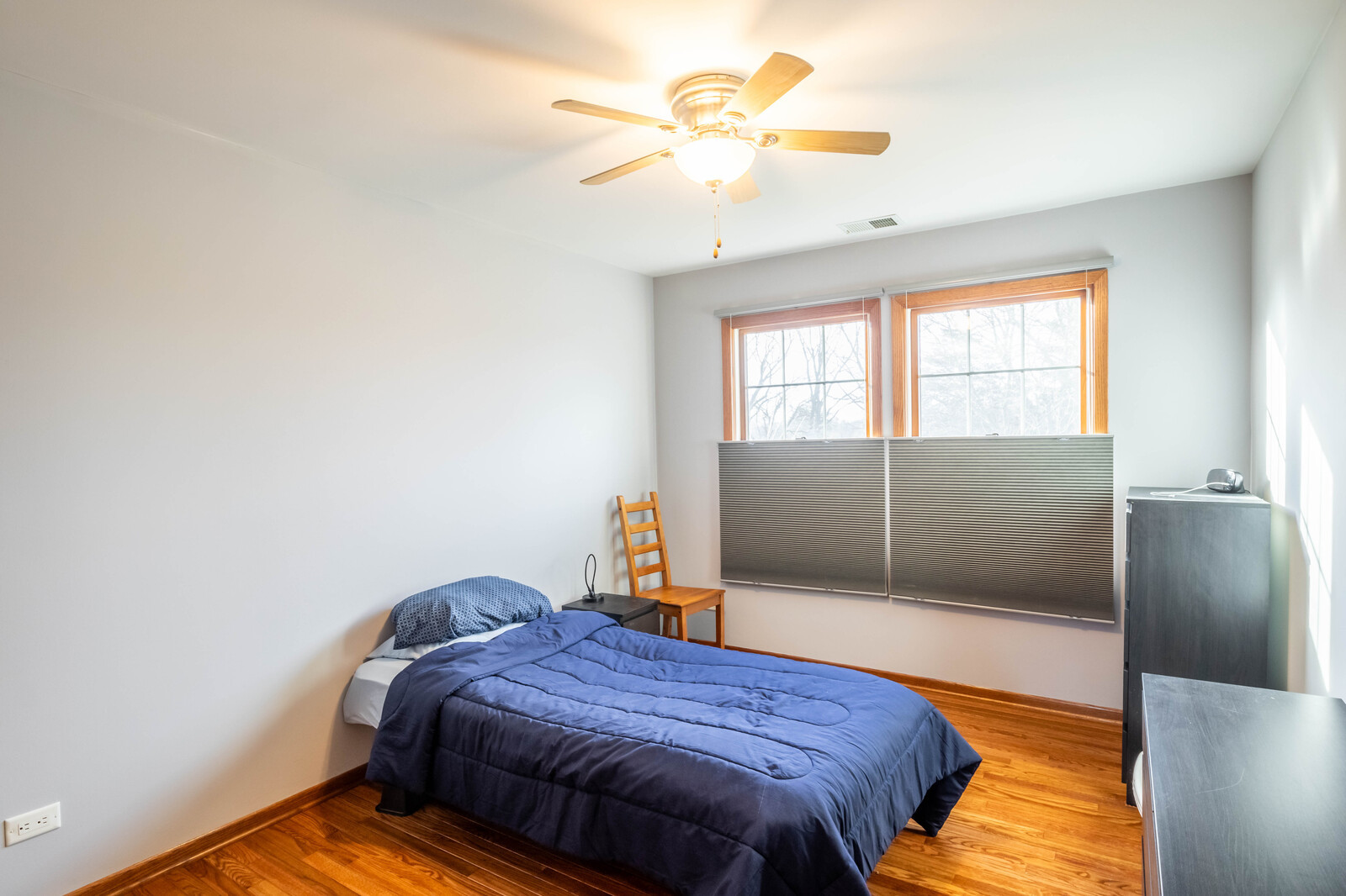 2306 Jay Lane Rolling Meadows, IL 60008 - Photo 19 of 30 a bedroom with a bed and a chandelier