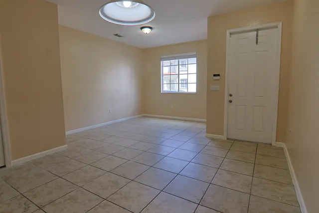 a view of an empty room and window