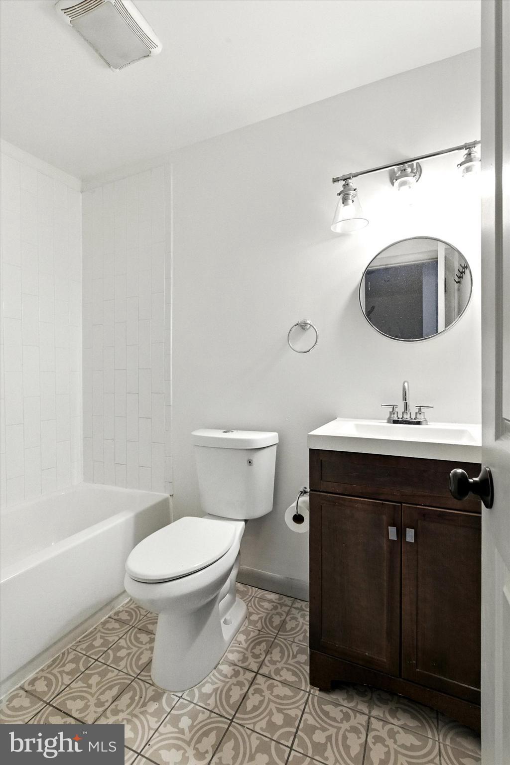754 Custis Street Aberdeen, MD 21001 - Photo 14 of 19 a bathroom with a sink toilet and shower