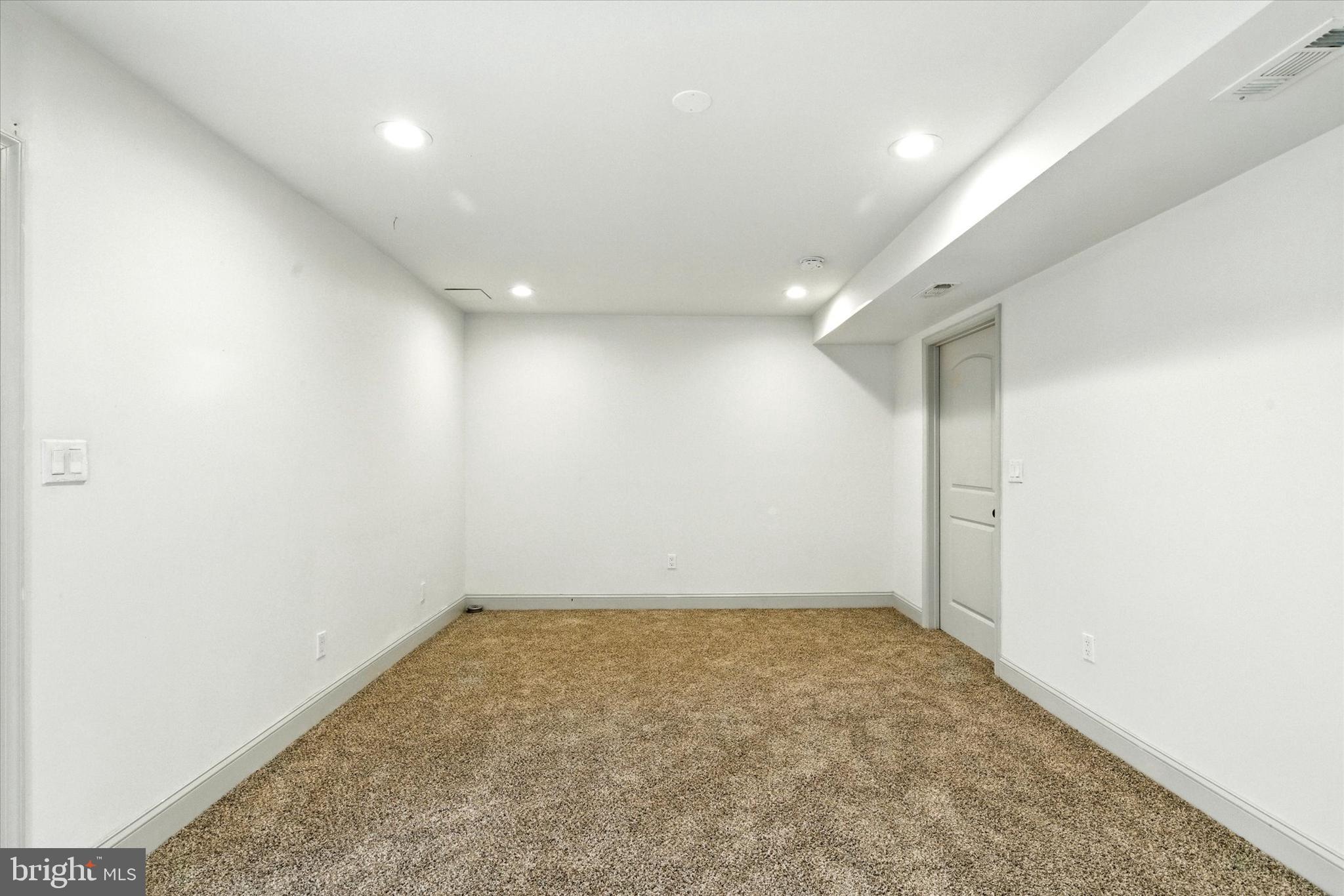 754 Custis Street Aberdeen, MD 21001 - Photo 15 of 19 an empty room with a workbench
