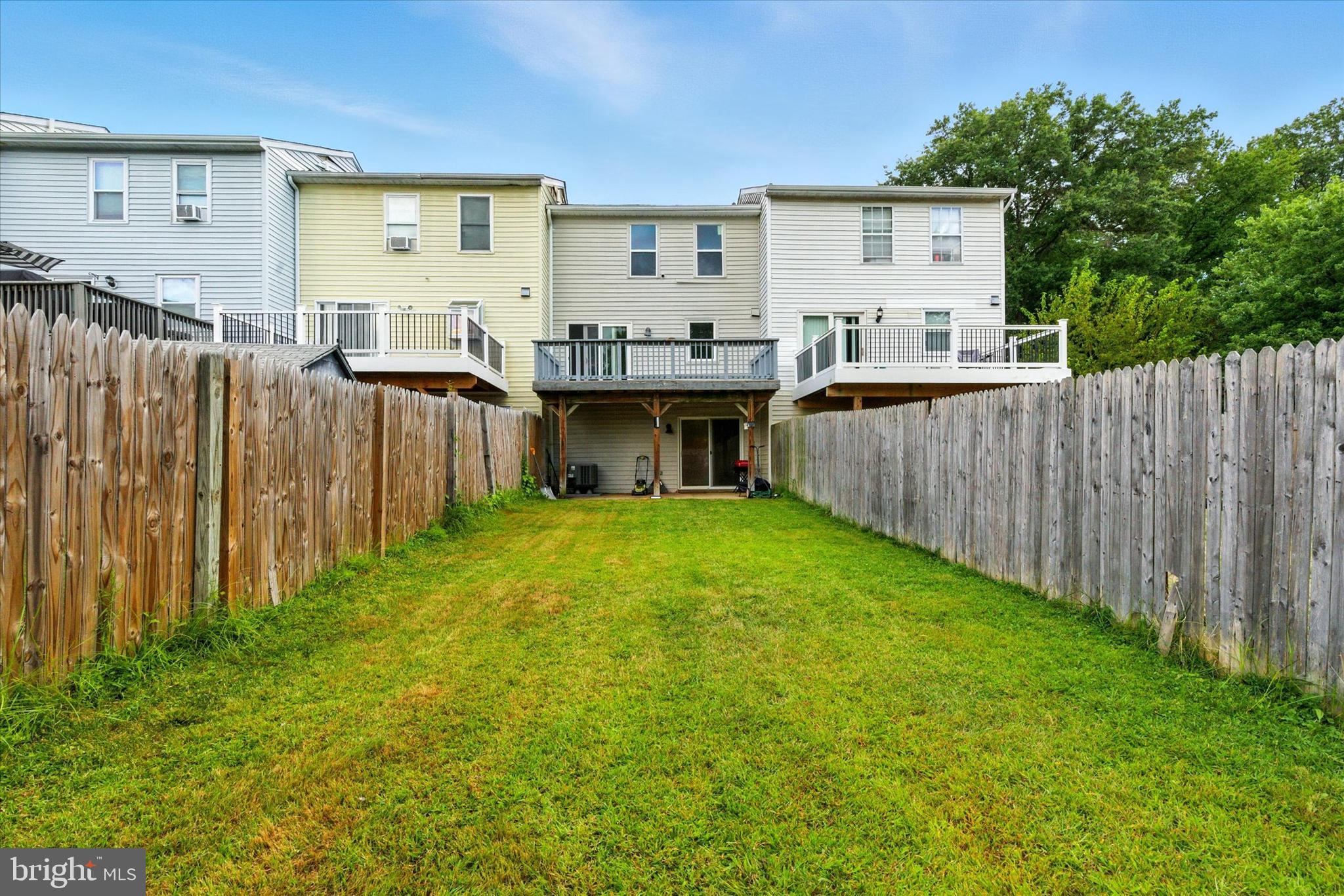 754 Custis Street Aberdeen, MD 21001 - Photo 17 of 19 a view of a house with backyard and wooden fence