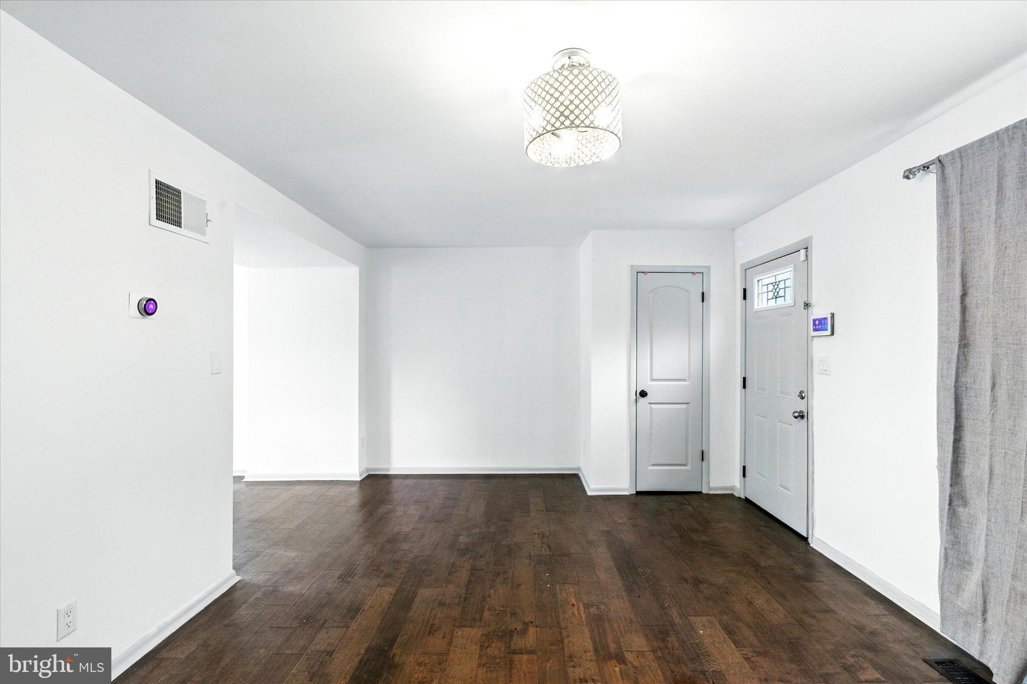 754 Custis Street Aberdeen, MD 21001 - Photo 2 of 19 a view of empty room with wooden floor