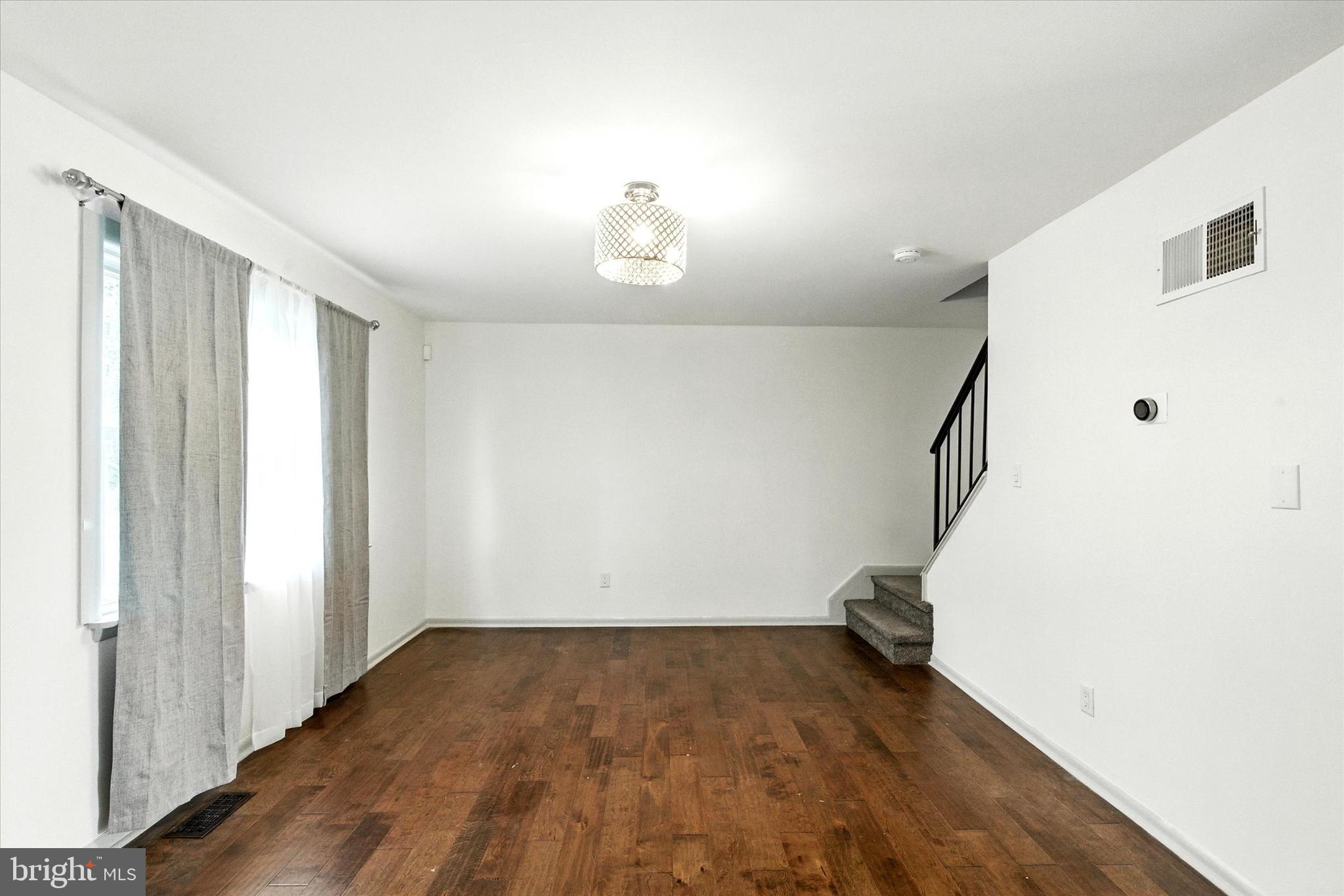 754 Custis Street Aberdeen, MD 21001 - Photo 3 of 19 a view of empty room with wooden floor