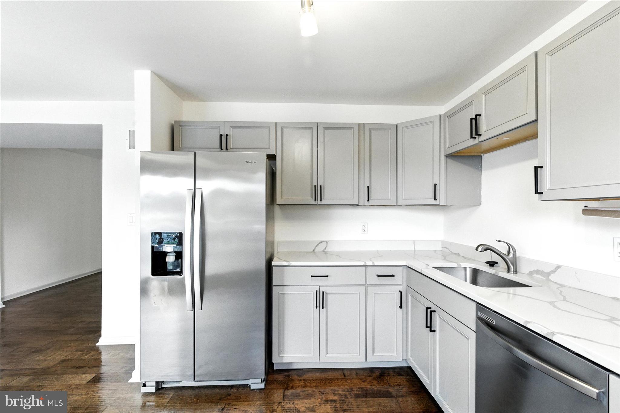 754 Custis Street Aberdeen, MD 21001 - Photo 5 of 19 a kitchen with stainless steel appliances granite countertop a refrigerator sink and cabinets