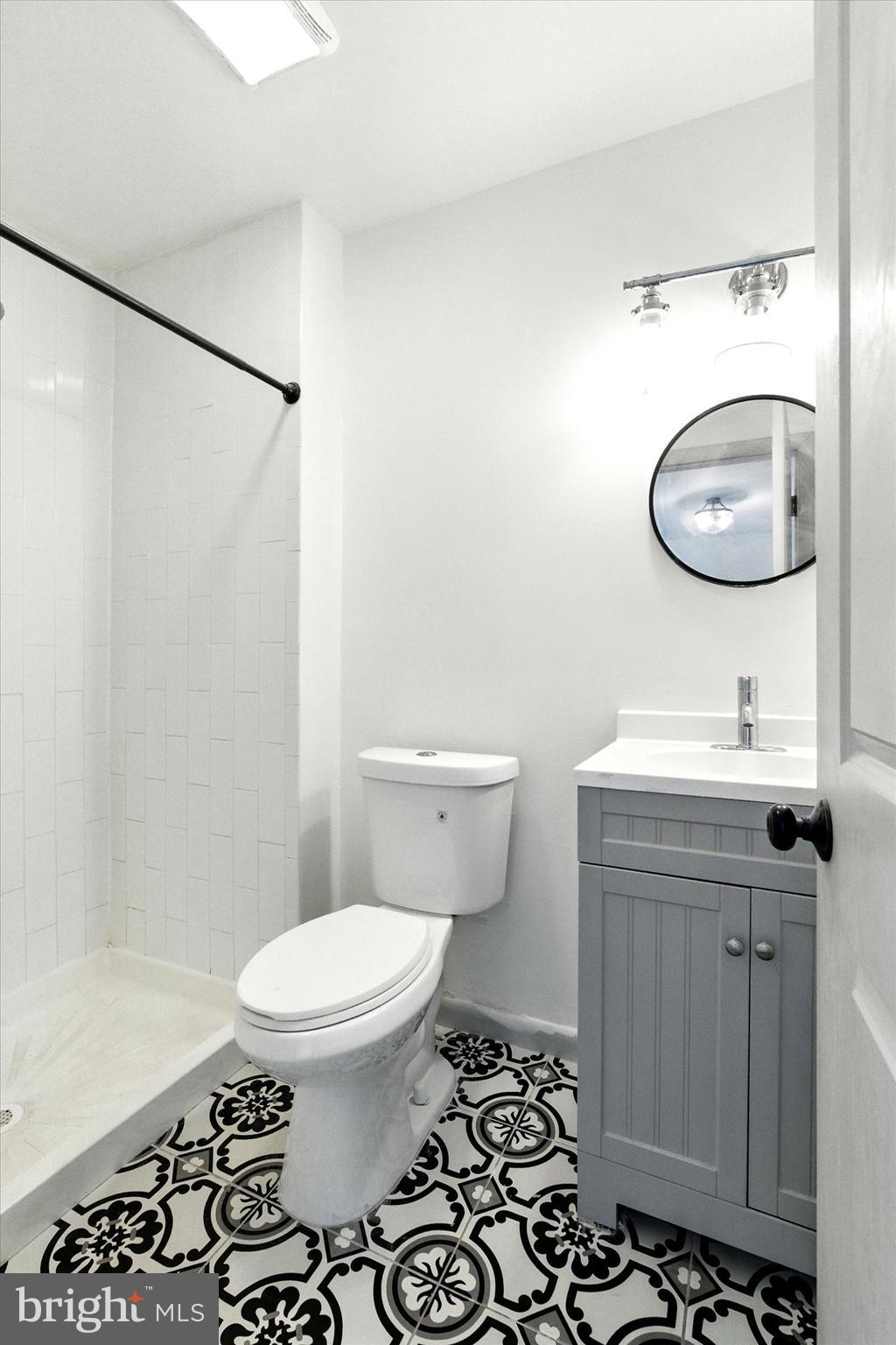 754 Custis Street Aberdeen, MD 21001 - Photo 9 of 19 a bathroom with a sink toilet and shower