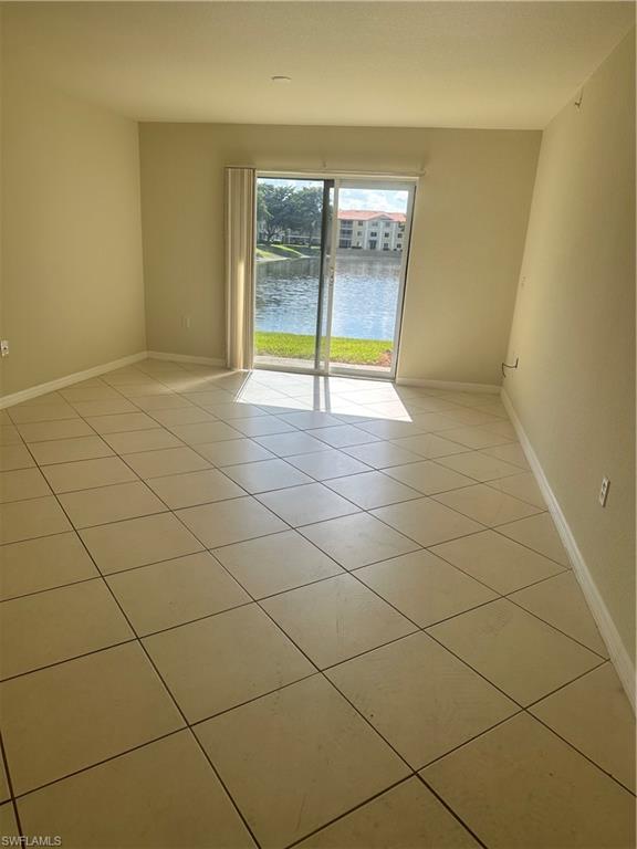 8234 Key Royal Circle, Unit 513 Naples, FL 34119 - Photo 2 of 5 an empty room with a empty space and a window