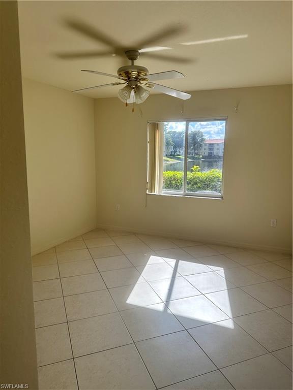 8234 Key Royal Circle, Unit 513 Naples, FL 34119 - Photo 5 of 5 a view of an empty room with a window