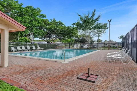 a view of a yard with a patio
