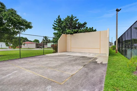 a view of a backyard with a garden and plants