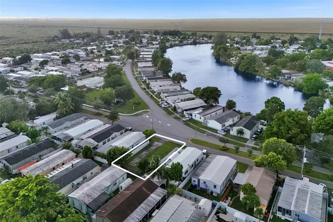 an aerial view of a house with a ocean view