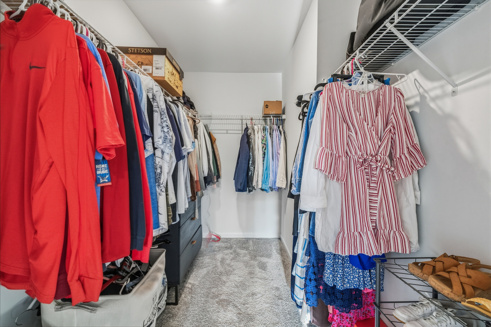 16316 Wheatgrass Street Lockport, IL 60441 - Photo 19 of 37 a view of walk in closet with clothes and shoes
