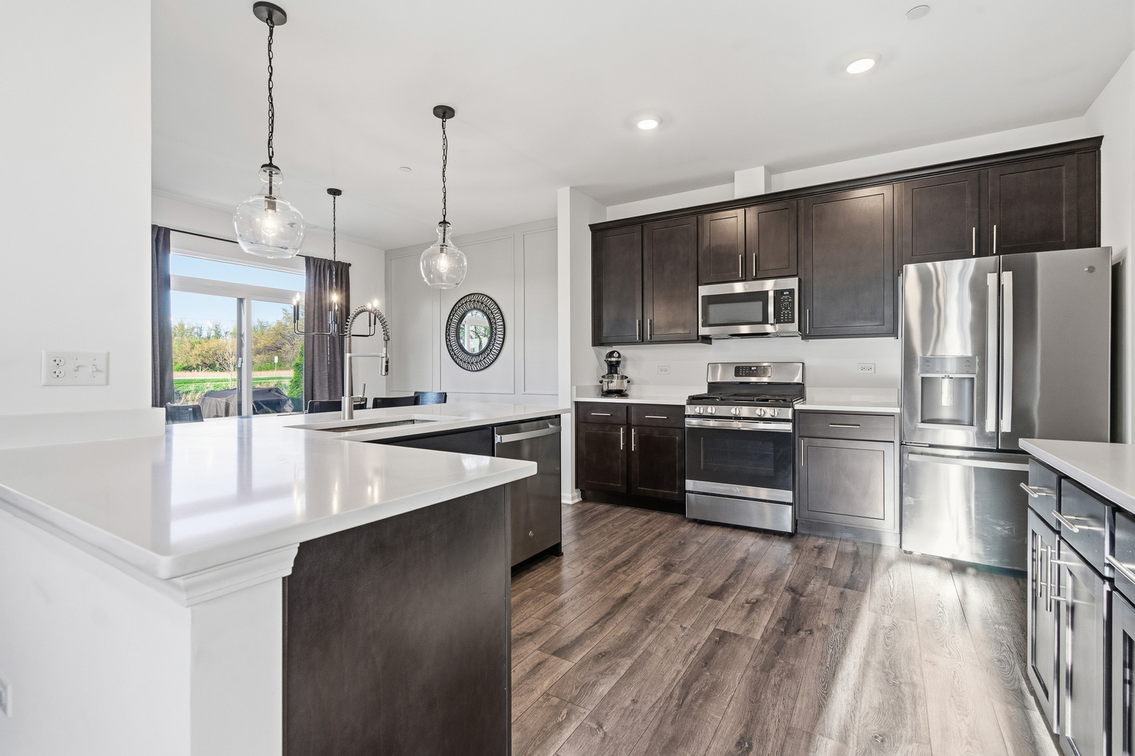 16316 Wheatgrass Street Lockport, IL 60441 - Photo 2 of 37 a large kitchen with a large stove a sink and stainless steel appliances