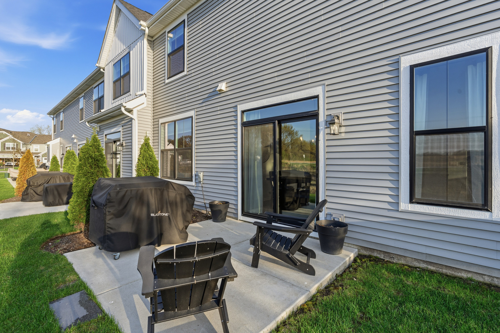 16316 Wheatgrass Street Lockport, IL 60441 - Photo 27 of 37 a view of a house with a backyard and a patio