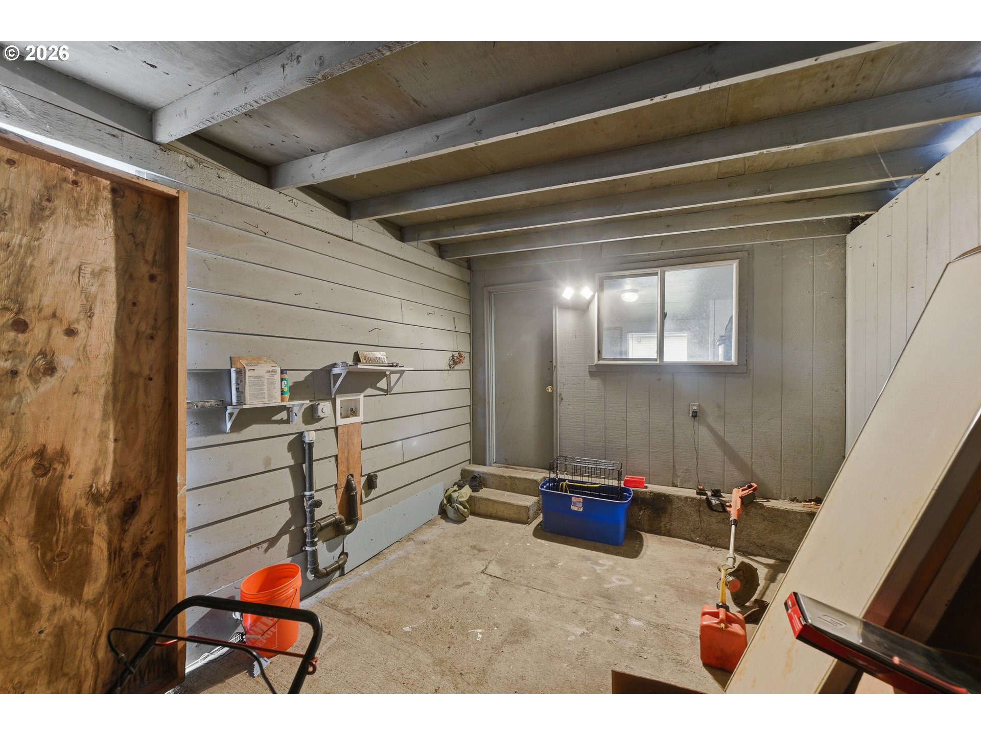 1955 Maple Street North Bend, OR 97459 - Photo 28 of 48 a room with gym equipment and a mirror