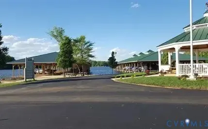 a view of an ocean with boats and trees around