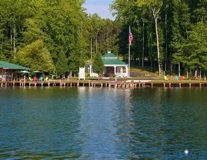 a view of a tennis ground with large trees