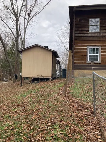 a backyard of a house with lots of green space