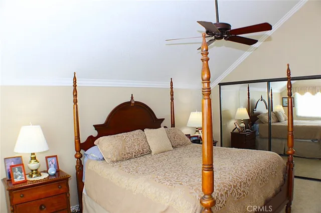 a bed room with a bed and a lamp