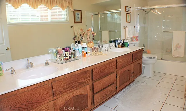 a bathroom with a sink double vanity and a mirror