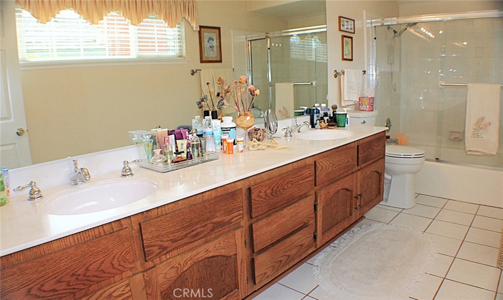 19 Black Oak Drive Phillips Ranch, CA 91766 - Photo 26 of 46 a bathroom with a sink double vanity and a mirror