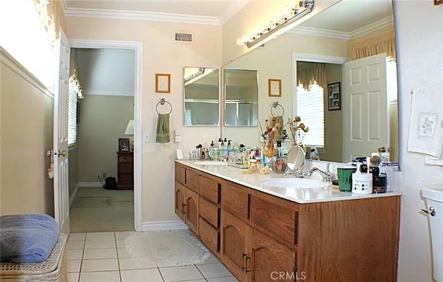 a bathroom with a sink mirror and shower