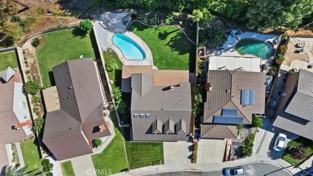 an aerial view of multiple houses with outdoor space