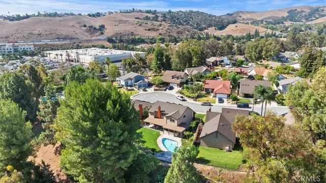 an aerial view of a house with a garden