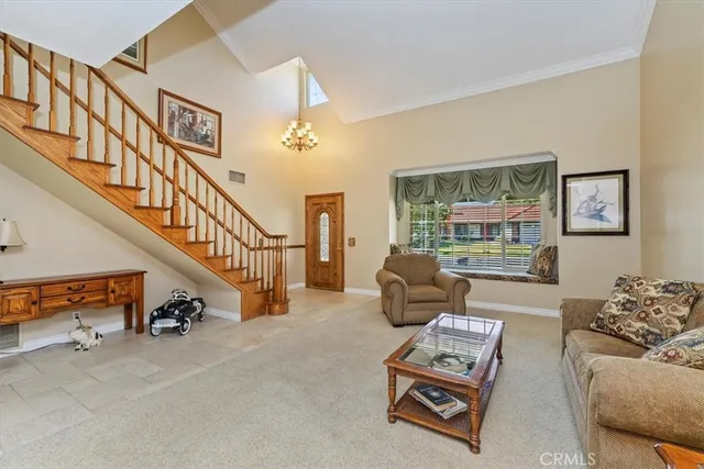 a living room with furniture and a windows
