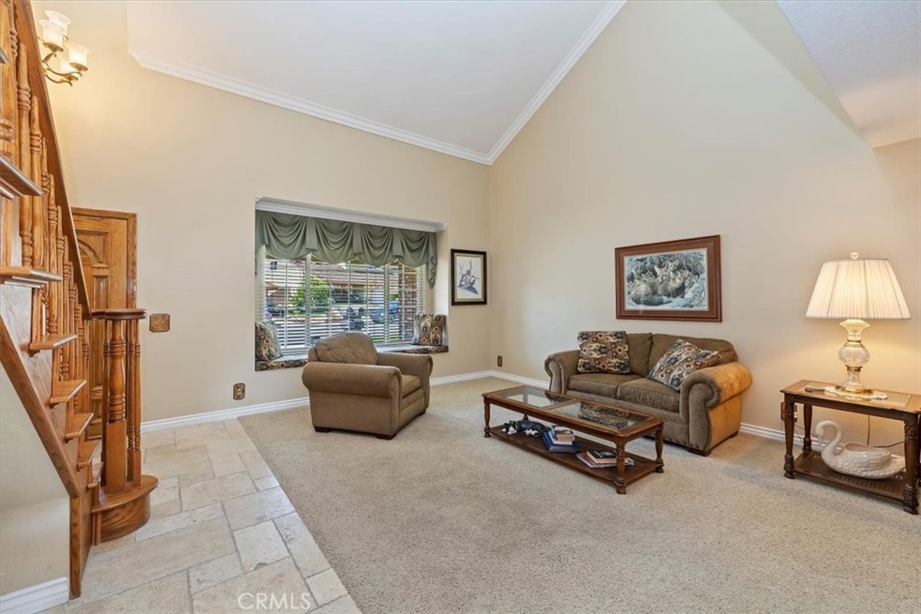 19 Black Oak Drive Phillips Ranch, CA 91766 - Photo 8 of 46 a living room with furniture gym equipment and a window
