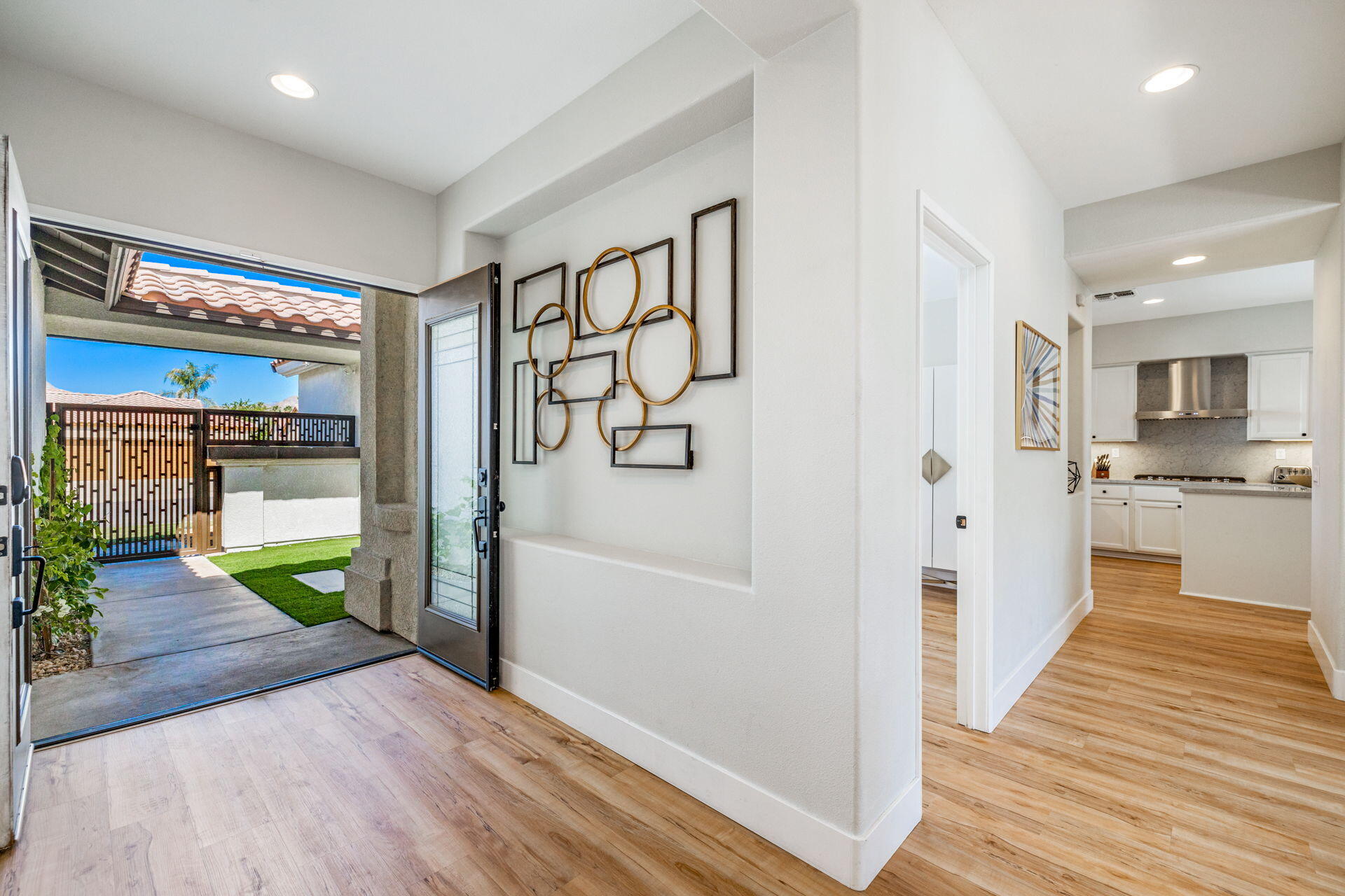 48674 Gibraltar Street Indio, CA 92201 - Photo 14 of 49 a bathroom with a glass shower door and a bathtub