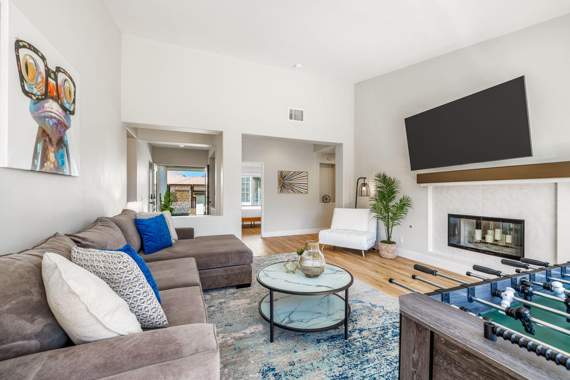 48674 Gibraltar Street Indio, CA 92201 - Photo 17 of 49 a living room with furniture a fireplace and a flat screen tv