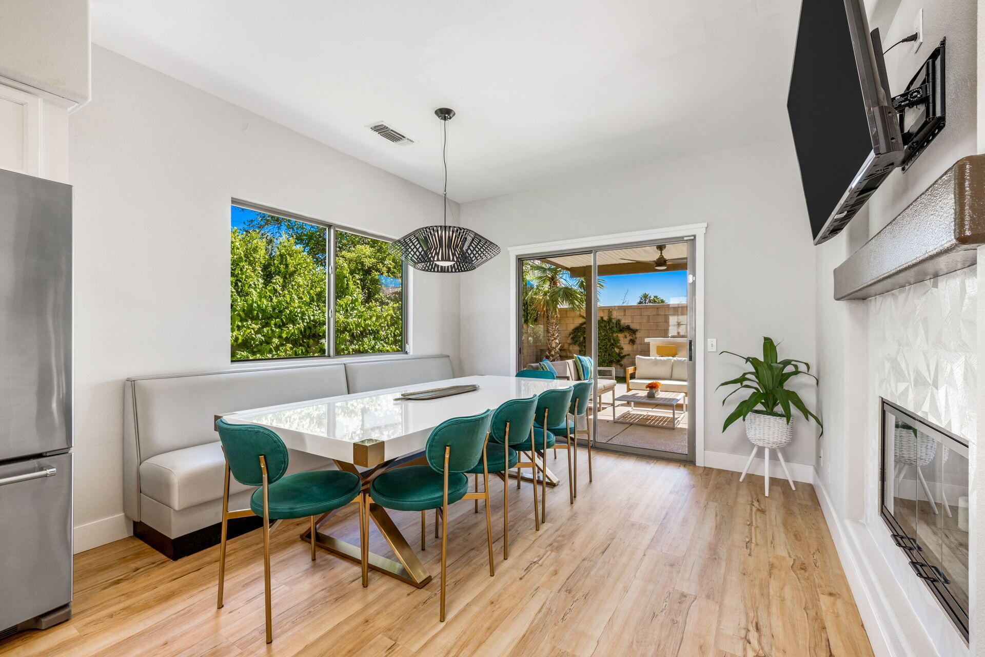 48674 Gibraltar Street Indio, CA 92201 - Photo 18 of 49 a view of a dining room with furniture window and wooden floor