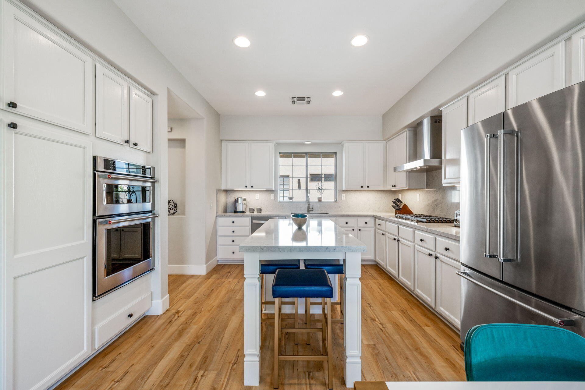 48674 Gibraltar Street Indio, CA 92201 - Photo 21 of 49 a kitchen with stainless steel appliances a refrigerator sink and cabinets