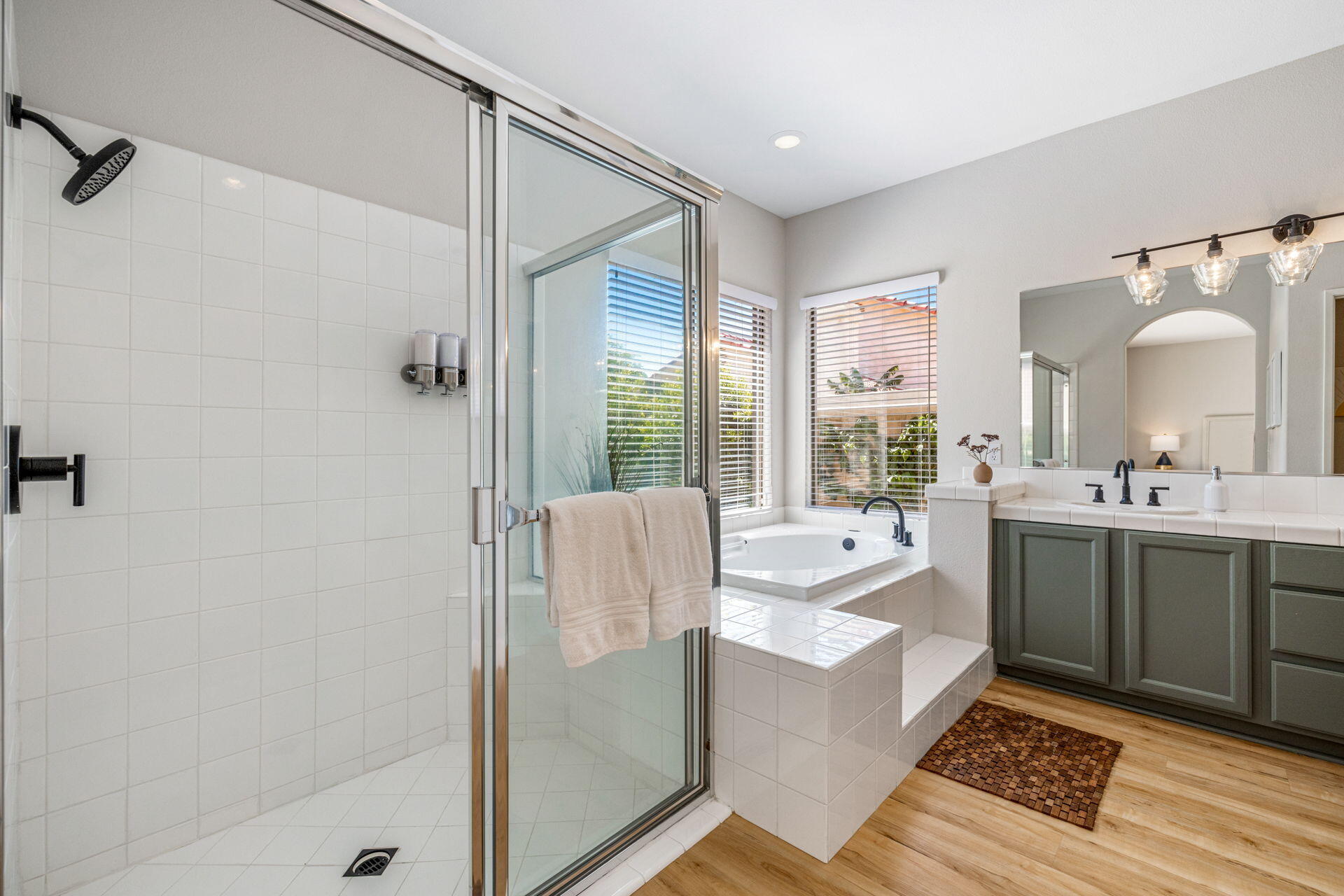 48674 Gibraltar Street Indio, CA 92201 - Photo 29 of 49 a bathroom with a tub sink shower and mirror