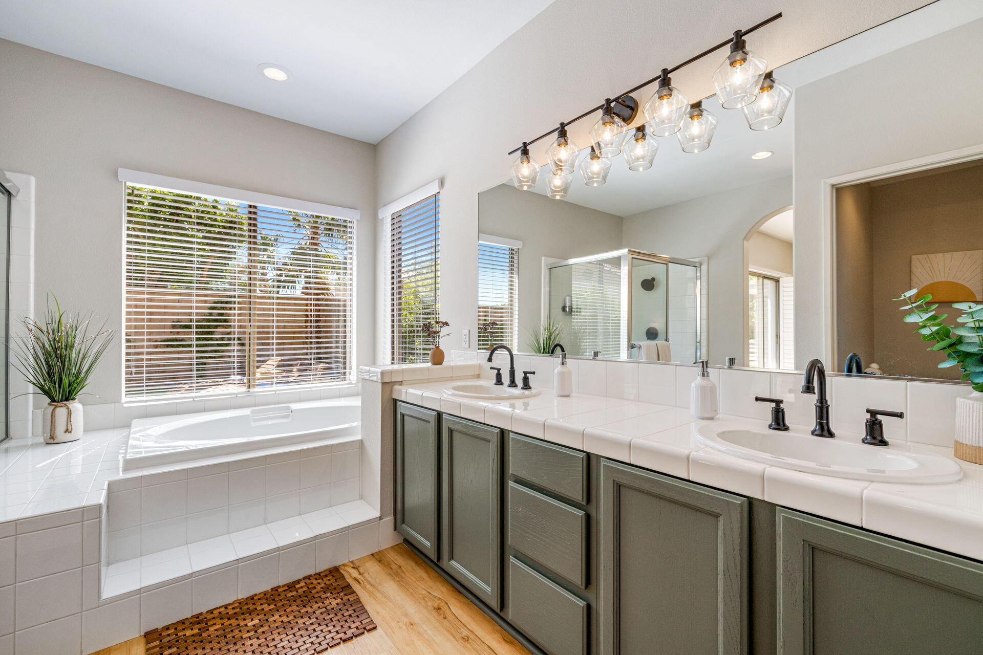 48674 Gibraltar Street Indio, CA 92201 - Photo 30 of 49 a bathroom with a large tub sink and mirror