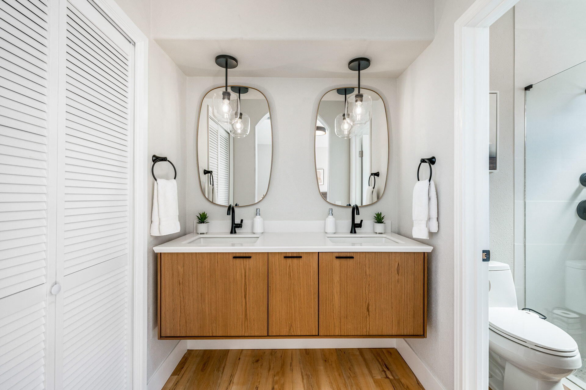 48674 Gibraltar Street Indio, CA 92201 - Photo 35 of 49 a bathroom with double vanity sink and a mirror