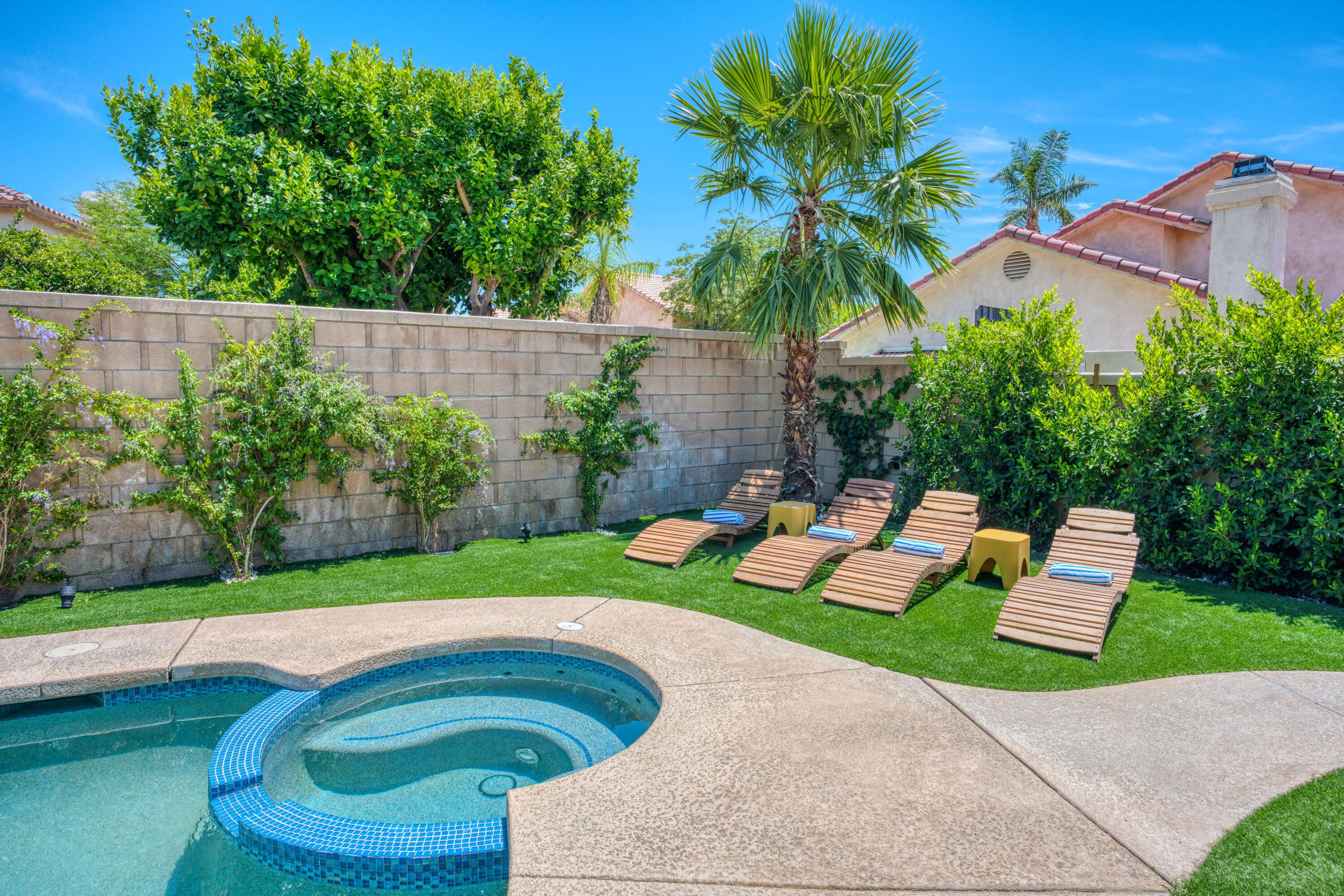 48674 Gibraltar Street Indio, CA 92201 - Photo 4 of 49 a garden view with a seating space