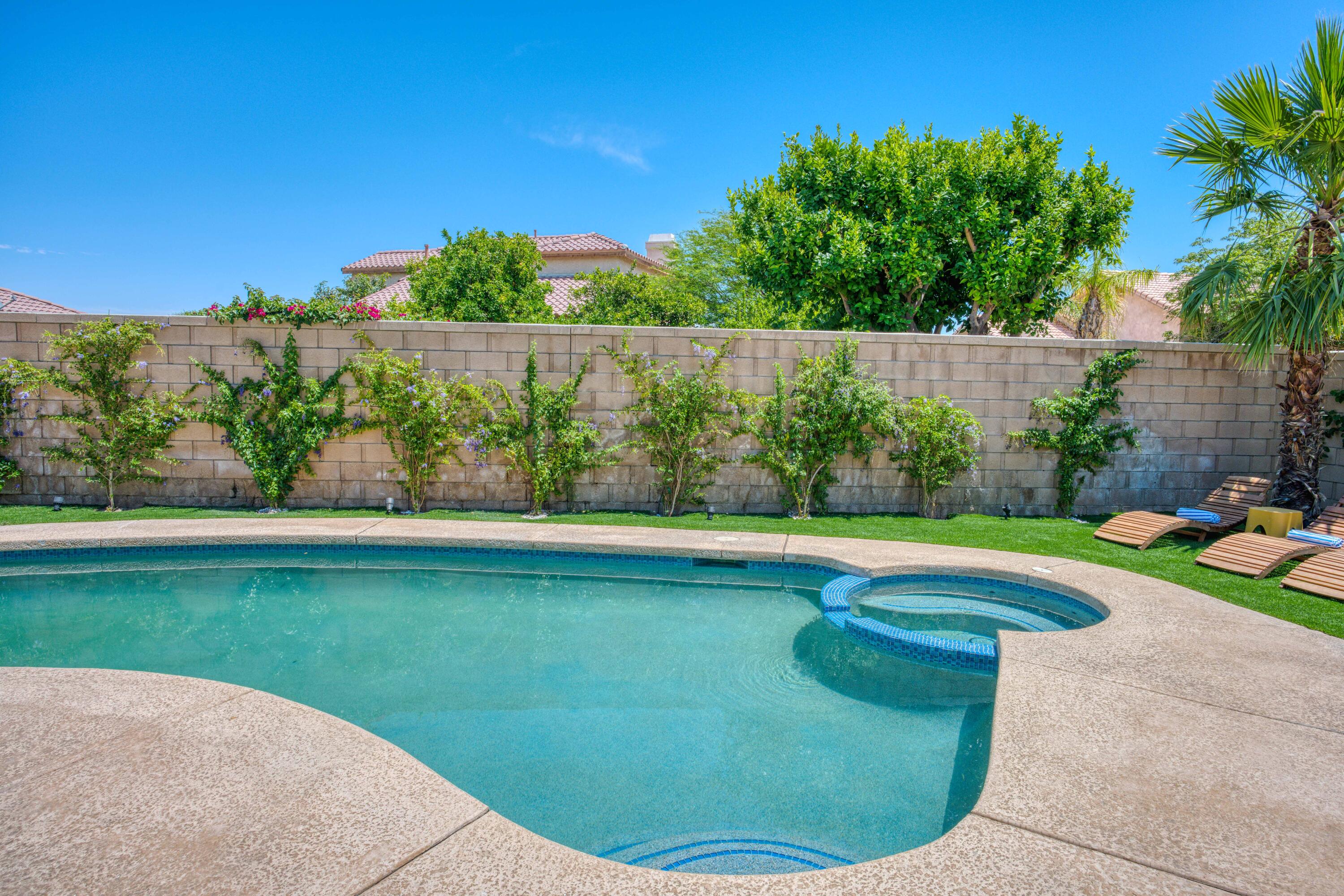 48674 Gibraltar Street Indio, CA 92201 - Photo 45 of 49 a view of a swimming pool with an outdoor space and seating area