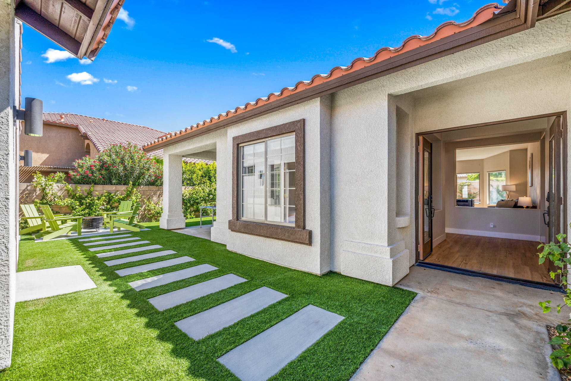 48674 Gibraltar Street Indio, CA 92201 - Photo 5 of 49 a front view of a house with a yard