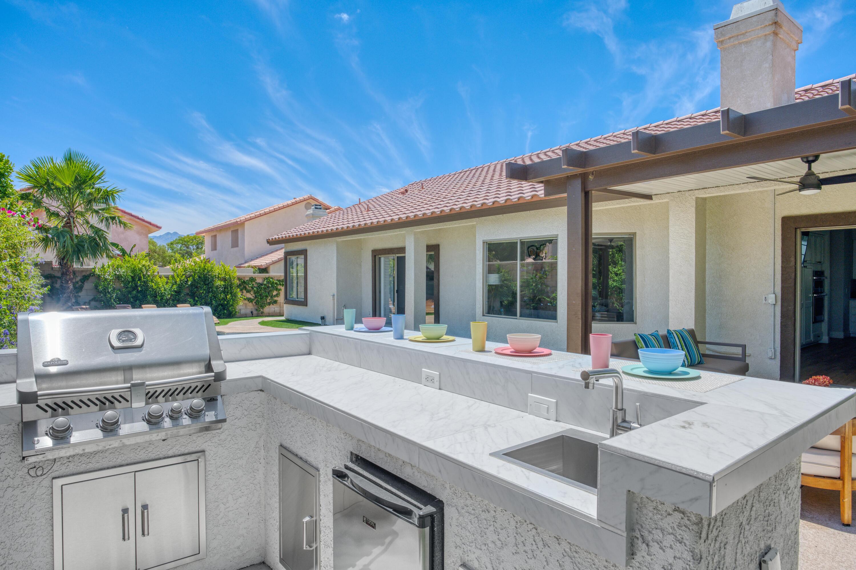 48674 Gibraltar Street Indio, CA 92201 - Photo 9 of 49 a view of kitchen with sink and refrigerator