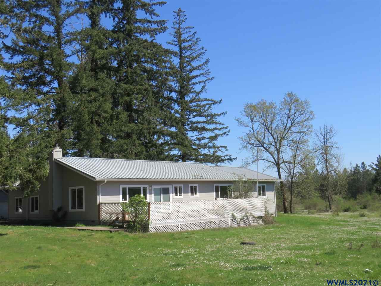 18990 Falls City Road Dallas, OR 97338 - Photo 2 of 42 a front view of house with yard and green space