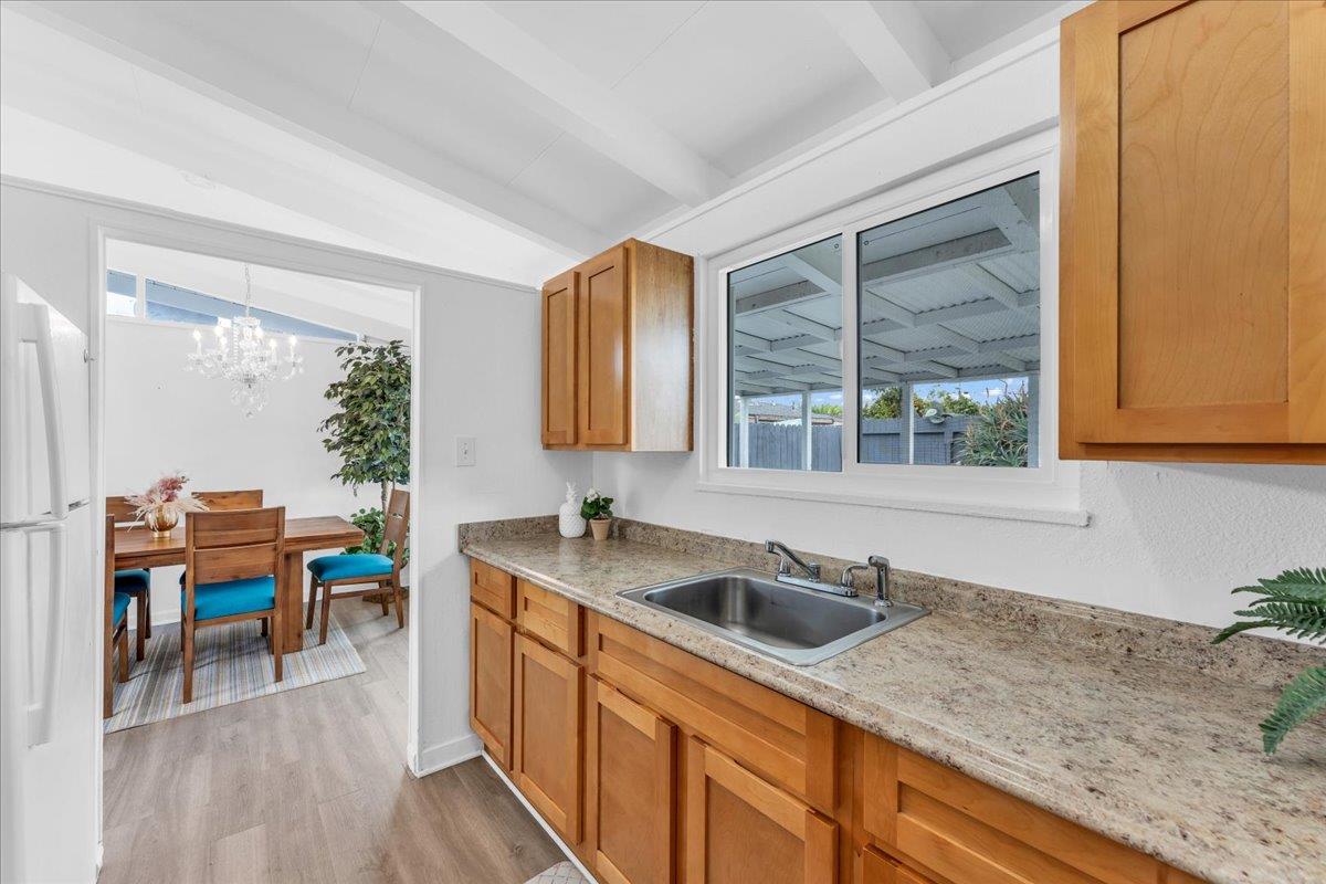 27837 Ormond Avenue Hayward, CA 94544 - Photo 12 of 26 a kitchen with stainless steel appliances granite countertop sink stove and cabinets