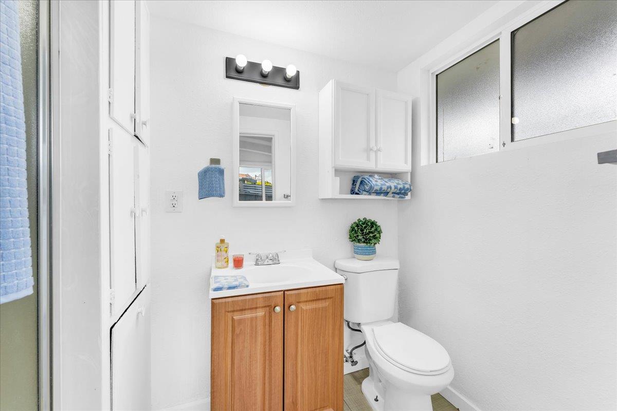27837 Ormond Avenue Hayward, CA 94544 - Photo 19 of 26 a white toilet sitting next to a bathroom sink